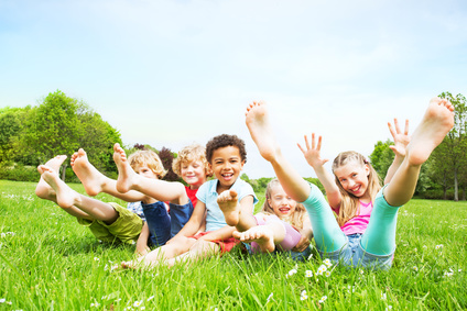 smiling kids on green grass